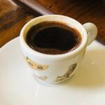 white ceramic cup on white ceramic saucer