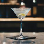 clear martini glass on brown wooden table