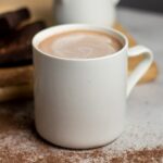 white ceramic mug with coffee